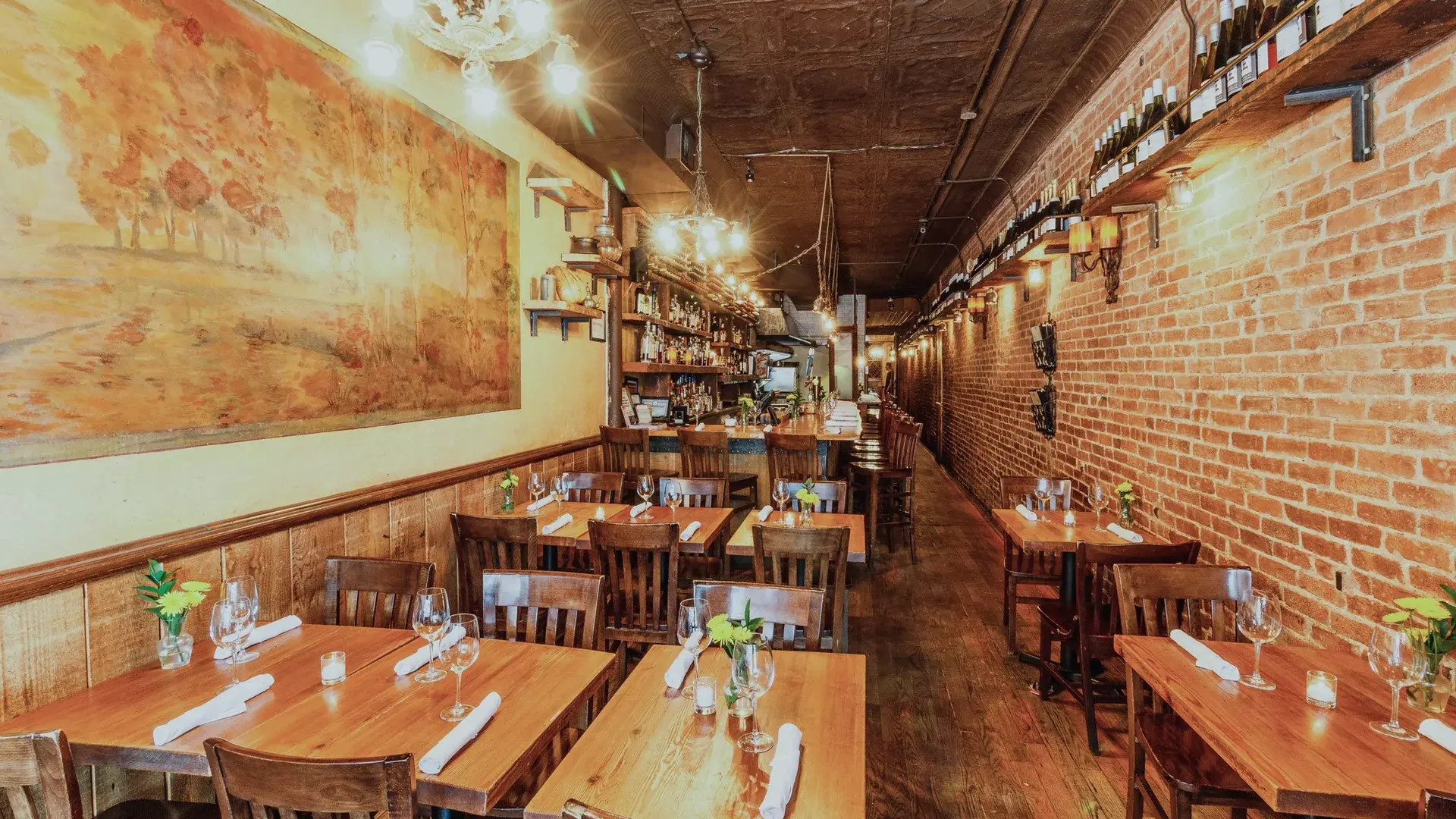 Our brick walls, restored murals and original tin ceiling