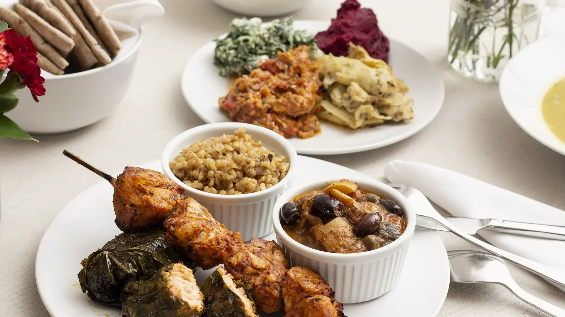 Grilled skewers with dips and warm pita at Kashkaval Garden